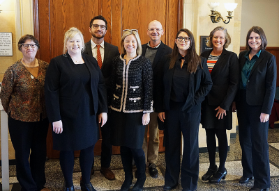 a group of lawyers who worked on the PolyMet air permit case standing and smiling