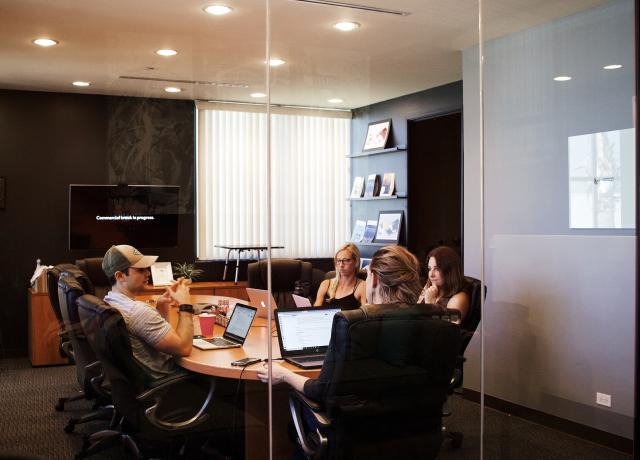 People sitting around a conference room