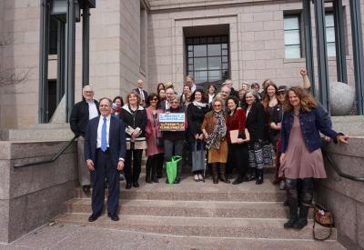 a group of advocates on the state capitol steps