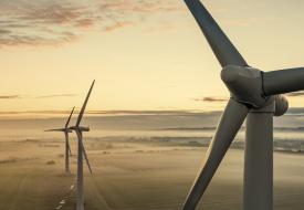 three windturbines with a sepia overtone