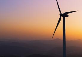 a wind turbine in a sunset